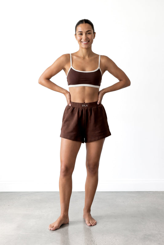 SYLA Sauna Top in espresso, front view with hands on hips