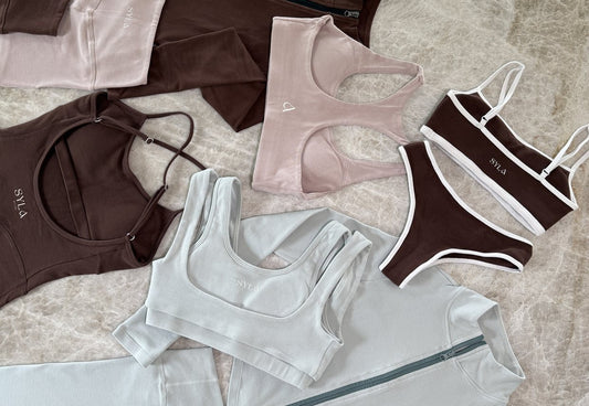 SYLA organic cotton sets laid flat in espresso, blush and sage