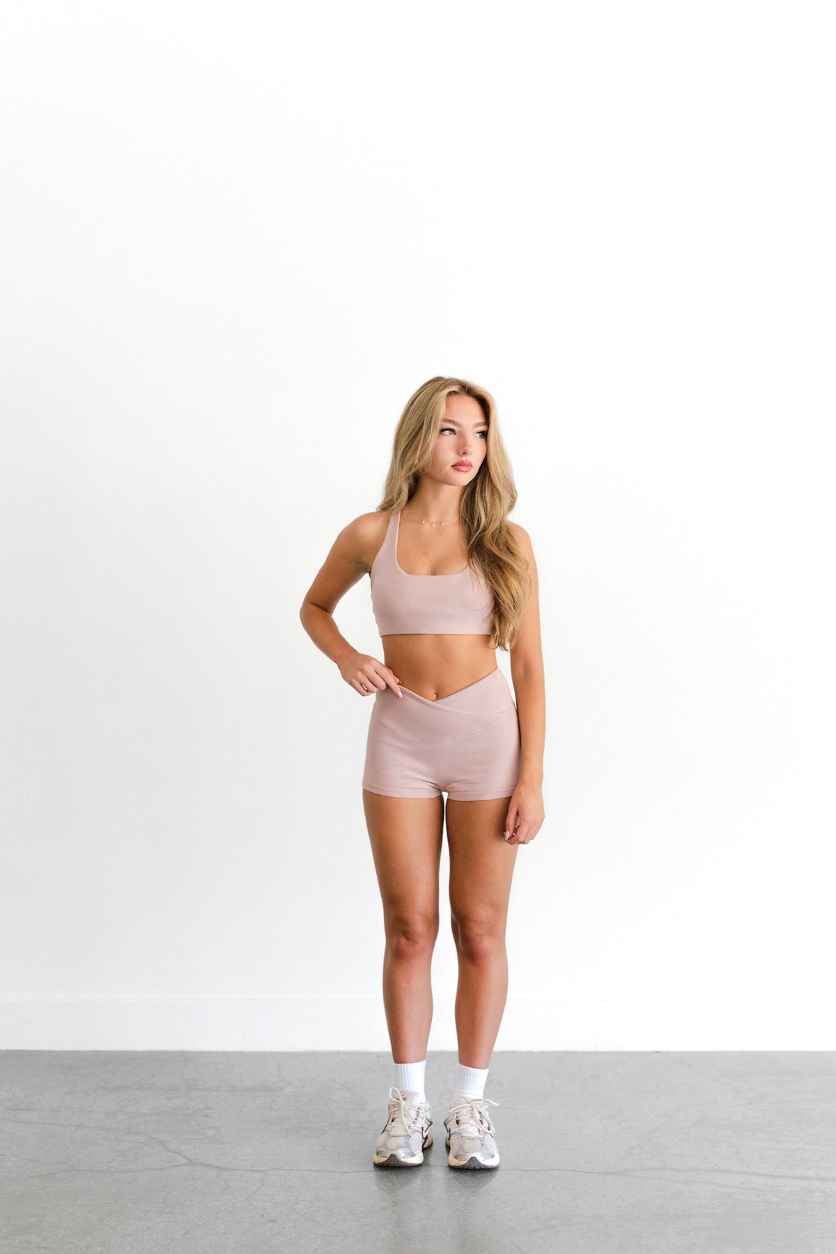 Front view of the blush SYLA Racer Top, scoop neckline shown with matching short